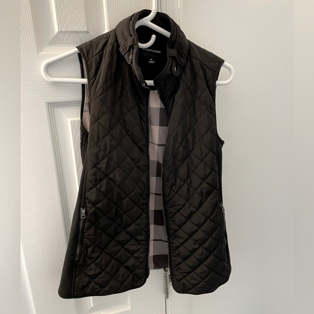 Like new, extremely comfortable black vest with plaid inner lining, size XS